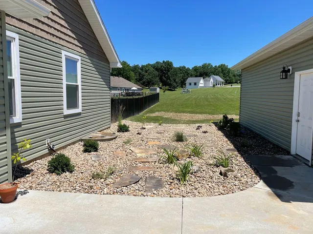 a view of a backyard with a garden