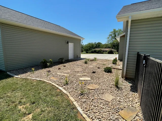 a view of a backyard of the house
