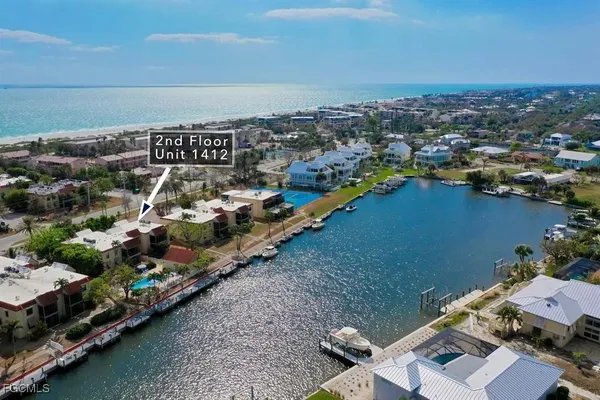 an aerial view of a house with a lake view