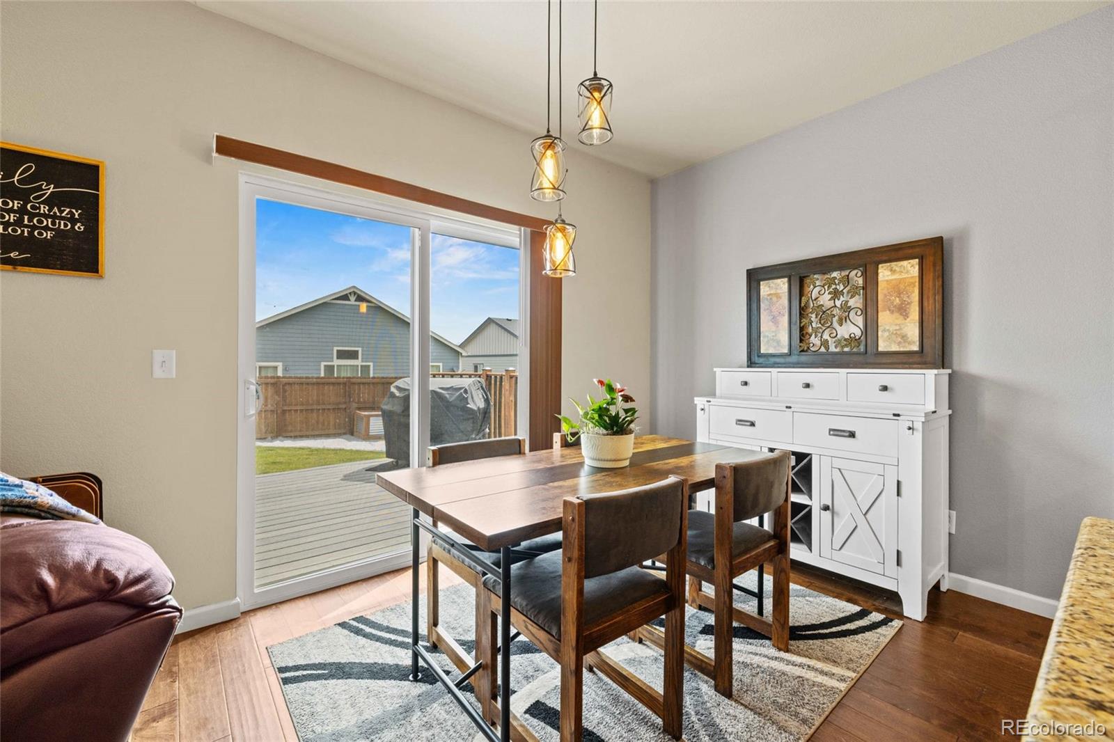 1030 Wagon Train Drive Milliken, CO 80543 - Photo 17 of 49 a view of a dining room with furniture window and outside view