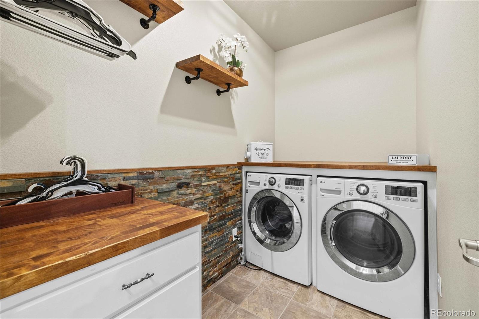 1030 Wagon Train Drive Milliken, CO 80543 - Photo 30 of 49 a utility room with dryer and washer
