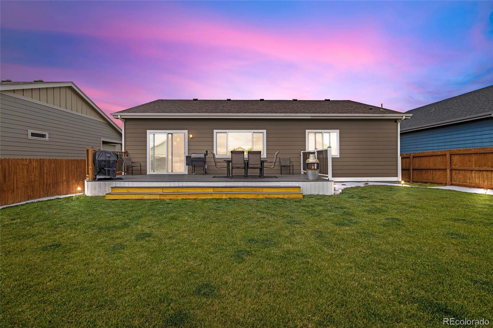 1030 Wagon Train Drive Milliken, CO 80543 - Photo 37 of 49 a front view of a house with a yard