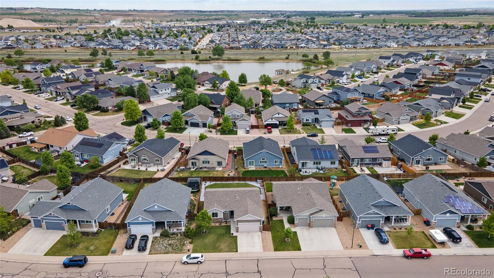 1030 Wagon Train Drive Milliken, CO 80543 - Photo 45 of 49 an aerial view of residential houses with outdoor space