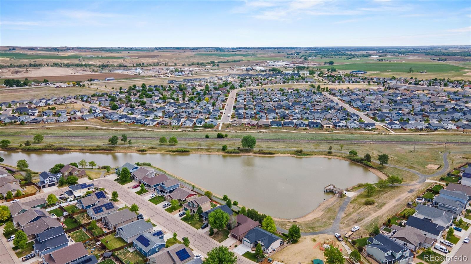 1030 Wagon Train Drive Milliken, CO 80543 - Photo 48 of 49 a view of a city with an ocean view