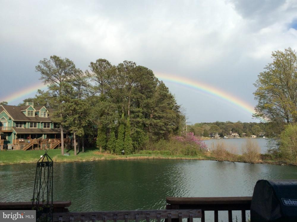 754 Bellefield Road, Unit 103 Solomons, MD 20629 - Photo 54 of 57 Serene lakeside retreat under a rainbow.
