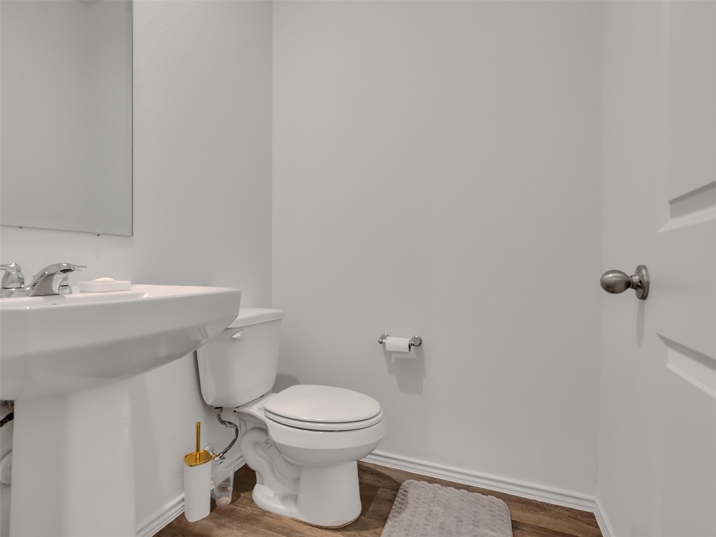 30903 Brightwell Bend Fulshear, TX 77441 - Photo 17 of 44 a bathroom with a sink toilet and a mirror