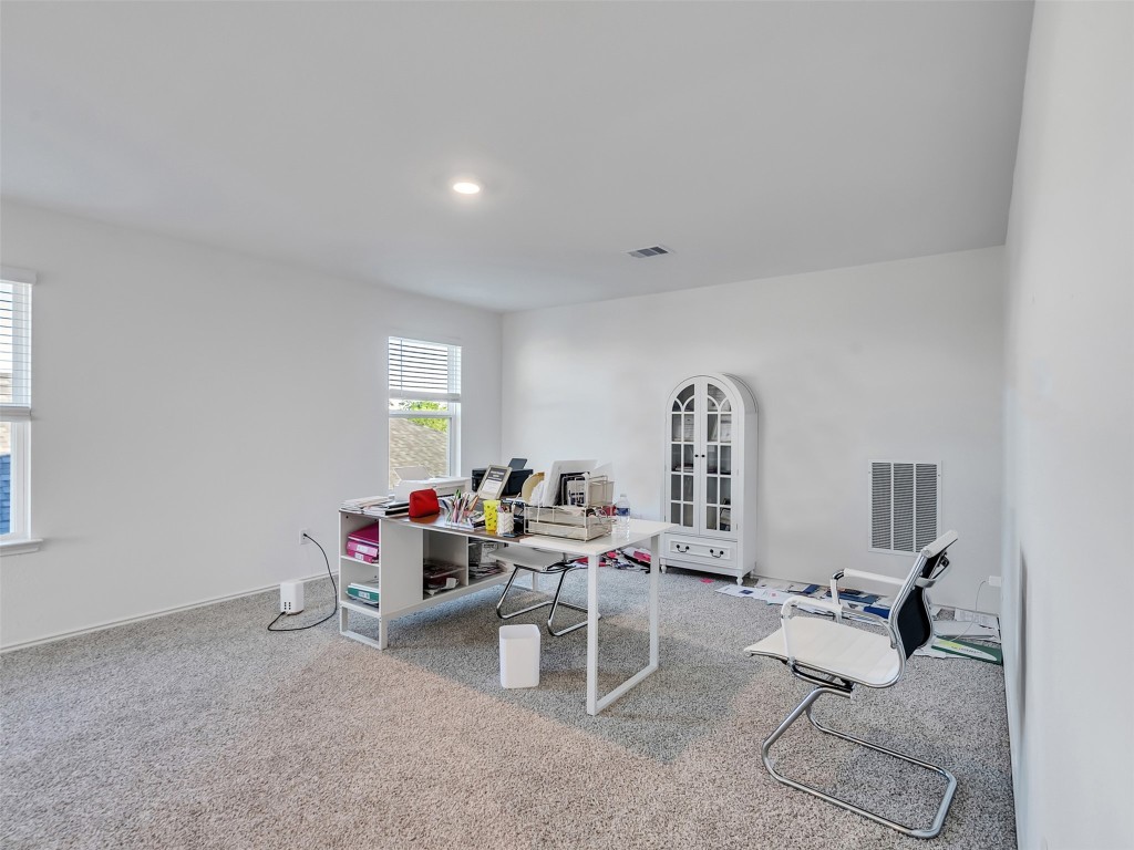 30903 Brightwell Bend Fulshear, TX 77441 - Photo 27 of 44 a living room with furniture and a wooden floor