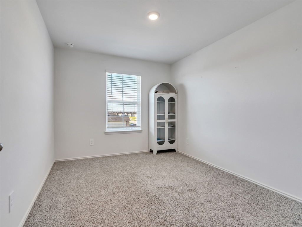 30903 Brightwell Bend Fulshear, TX 77441 - Photo 28 of 44 an empty room with windows