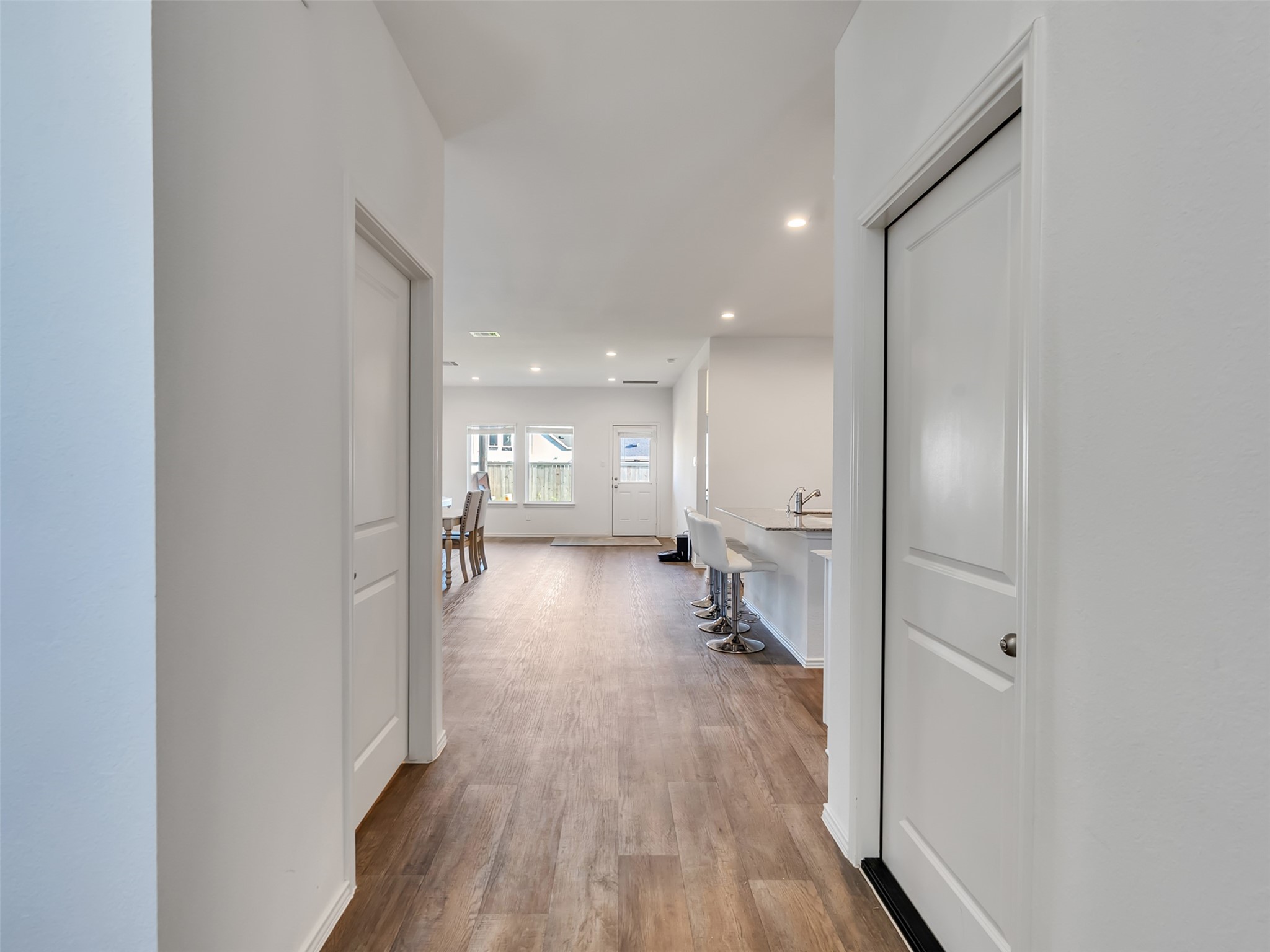 30903 Brightwell Bend Fulshear, TX 77441 - Photo 4 of 44 a view of a hallway with wooden floor