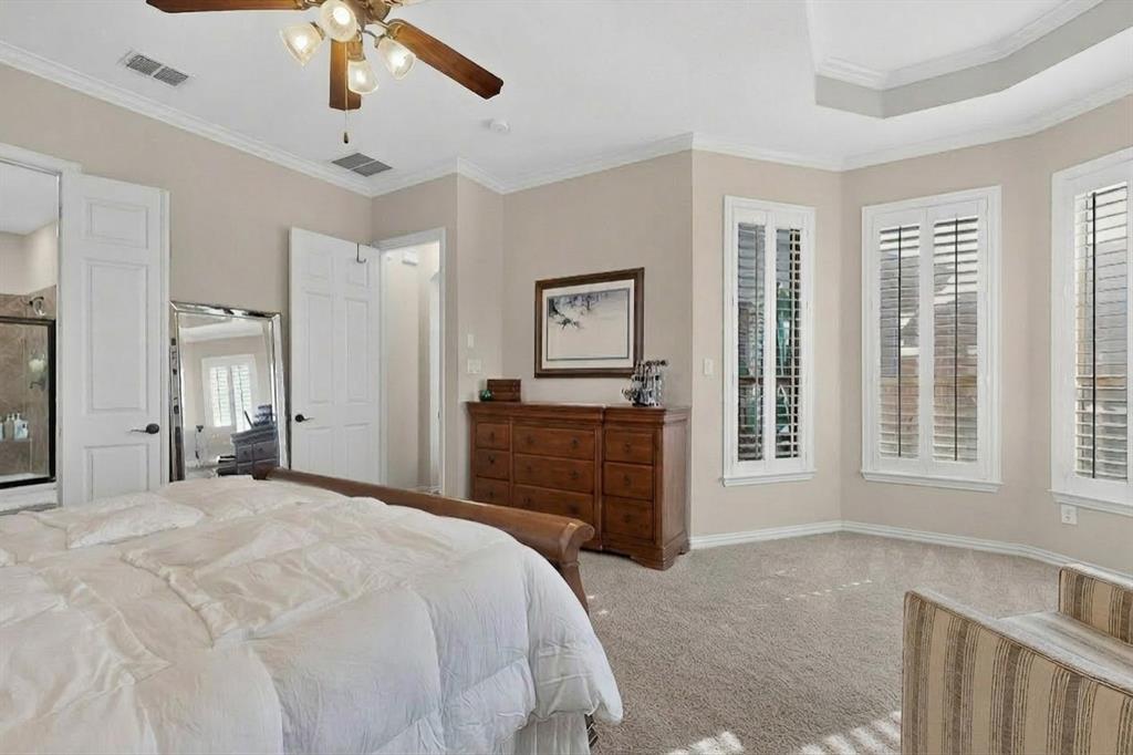 7625 Ridgedale Court Sachse, TX 75048 - Photo 17 of 40 AI, Bedroom with crown molding, light carpet, and ceiling fan