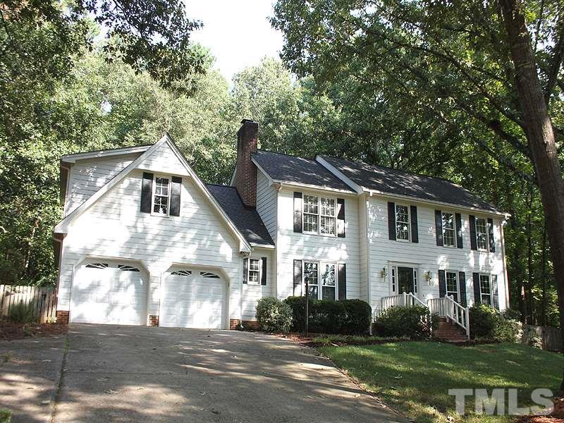 9905 Waterview Road Raleigh, NC 27615 - Photo 1 of 21 a view of a white house next to a yard with large trees