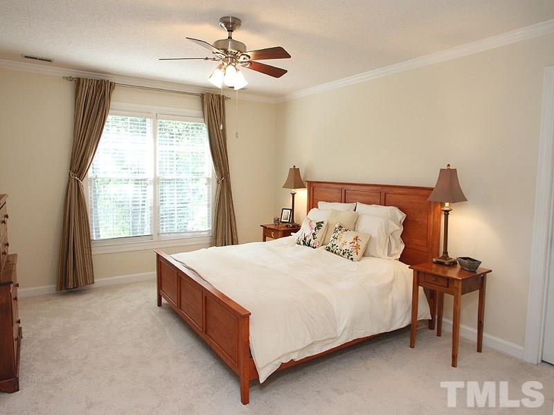 9905 Waterview Road Raleigh, NC 27615 - Photo 11 of 21 a bedroom with a bed and a large window