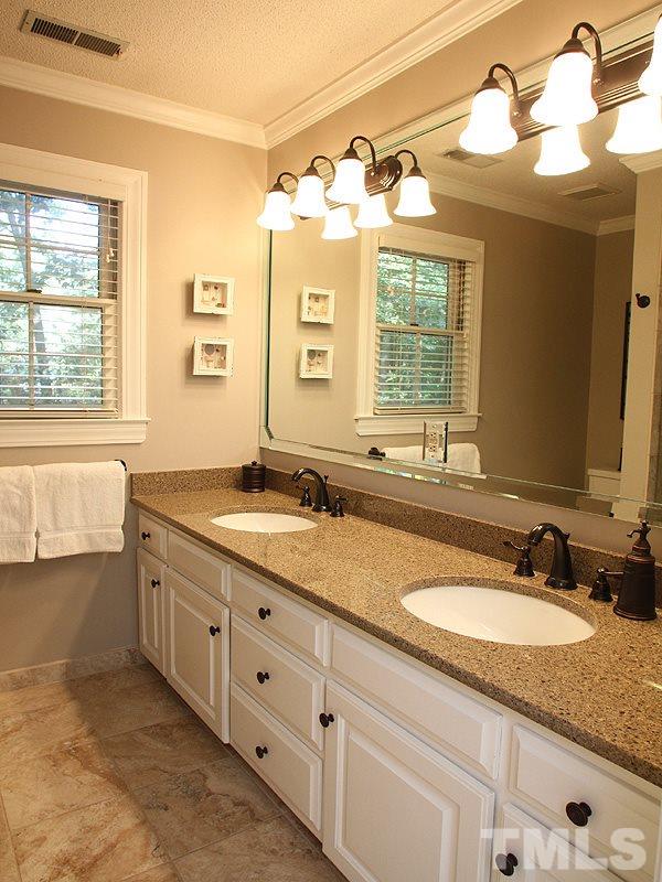 9905 Waterview Road Raleigh, NC 27615 - Photo 12 of 21 a bathroom with a granite countertop sink mirror and a