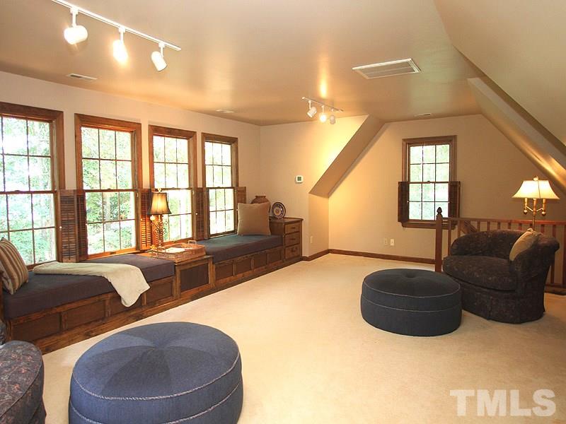 9905 Waterview Road Raleigh, NC 27615 - Photo 16 of 21 a living room with furniture and a large window