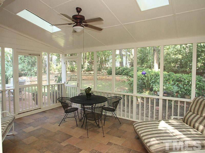 9905 Waterview Road Raleigh, NC 27615 - Photo 17 of 21 a dining room with furniture water view and a floor to ceiling window
