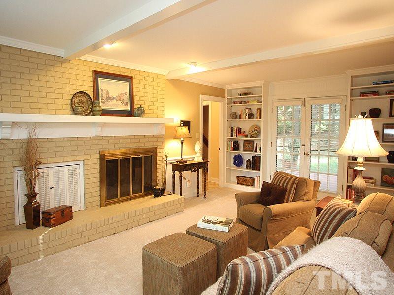 9905 Waterview Road Raleigh, NC 27615 - Photo 4 of 21 a living room with furniture window and a fireplace