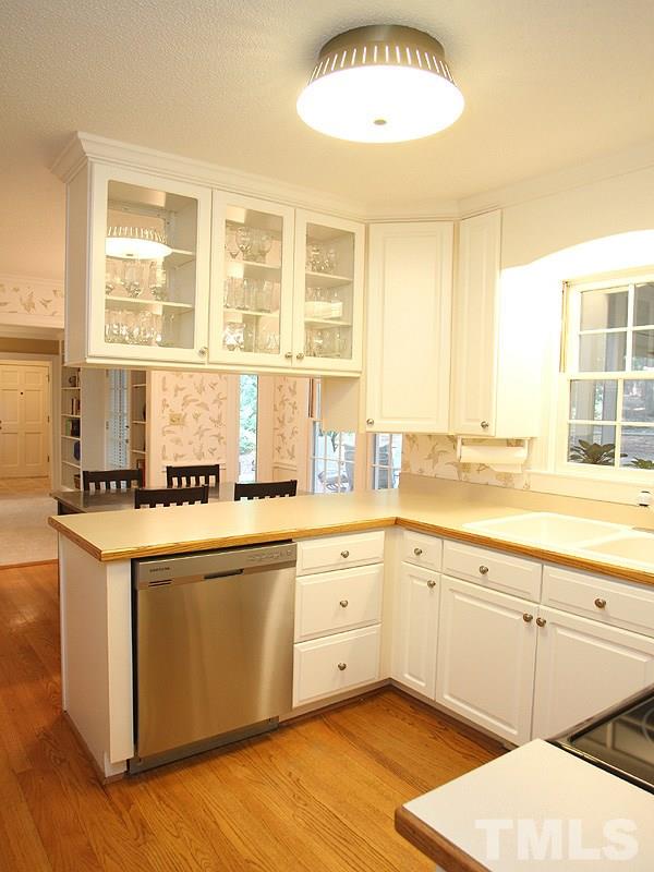 9905 Waterview Road Raleigh, NC 27615 - Photo 7 of 21 a kitchen with stainless steel appliances granite countertop a sink and cabinets