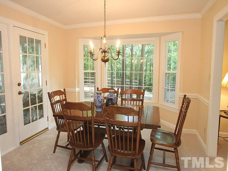 9905 Waterview Road Raleigh, NC 27615 - Photo 8 of 21 a view of a dining room with furniture window and outside view