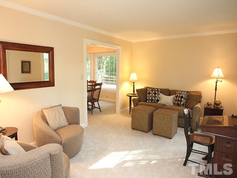9905 Waterview Road Raleigh, NC 27615 - Photo 9 of 21 a living room with furniture and a lamp