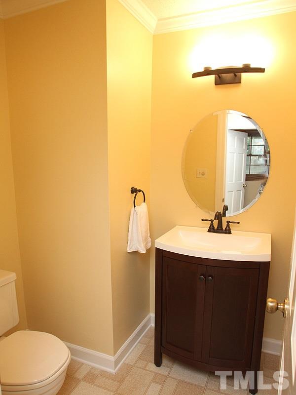 9905 Waterview Road Raleigh, NC 27615 - Photo 10 of 21 a bathroom with a sink and a mirror