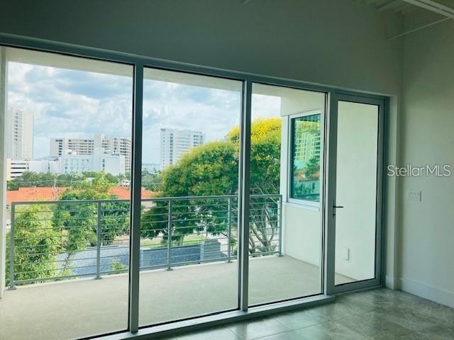 332 Cocoanut Avenue, Unit 505 Sarasota, FL 34236 - Photo 8 of 10 a view of a glass door and porch