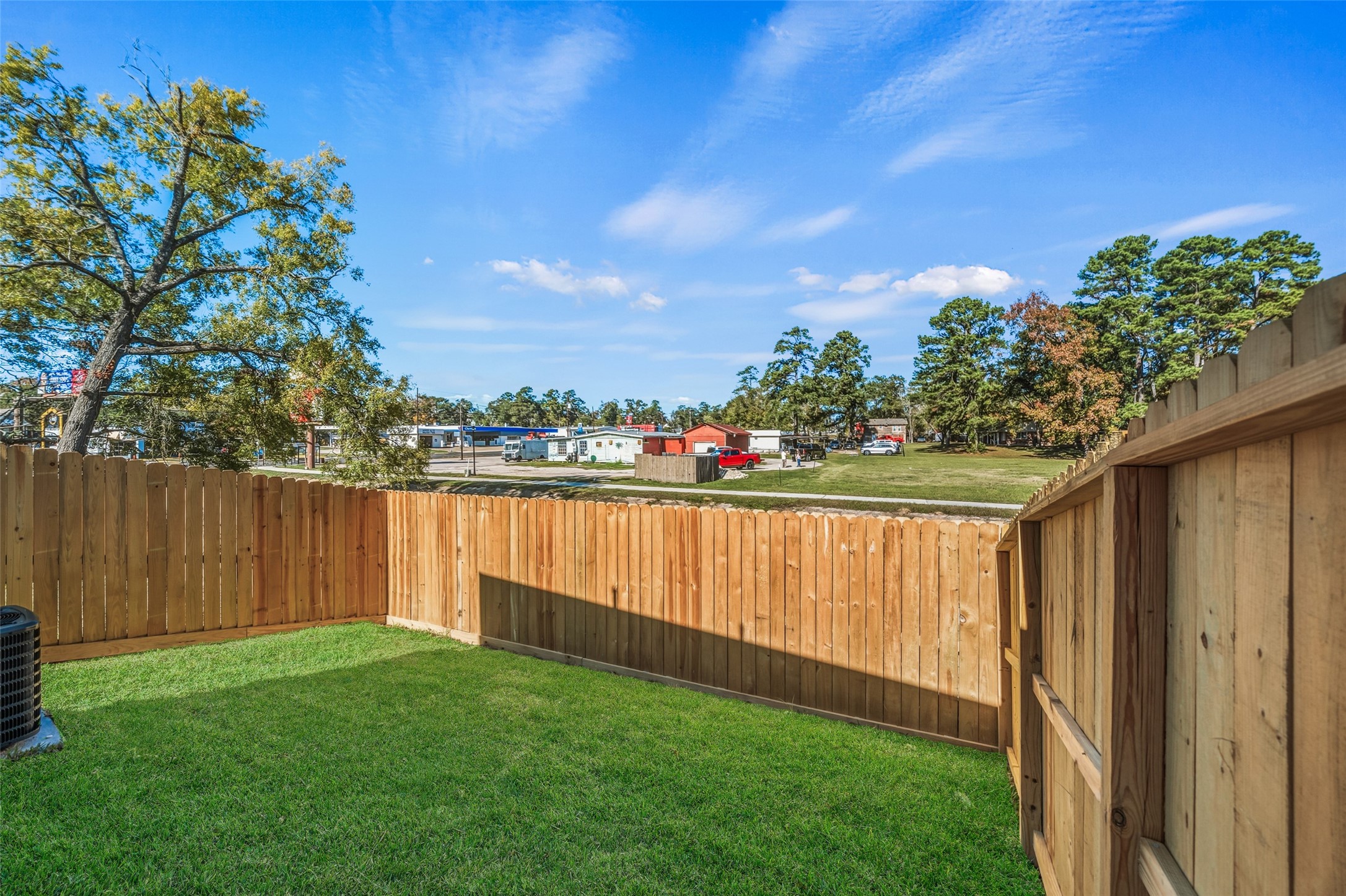 714 West Dallas Street Conroe, TX 77301 - Photo 18 of 19 a view of outdoor space with deck and yard