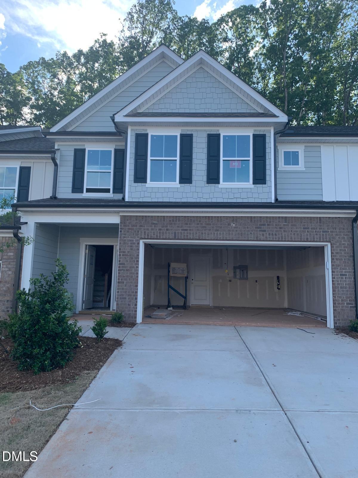 233 Broomside Avenue Raleigh, NC 27603 - Photo 2 of 18 a front view of a house with garage