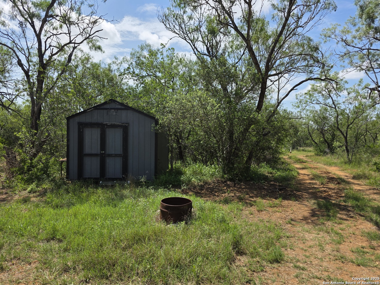 445 Marrou Road Seguin, TX 78155 - Photo 7 of 14 a backyard of a house with lots of green space