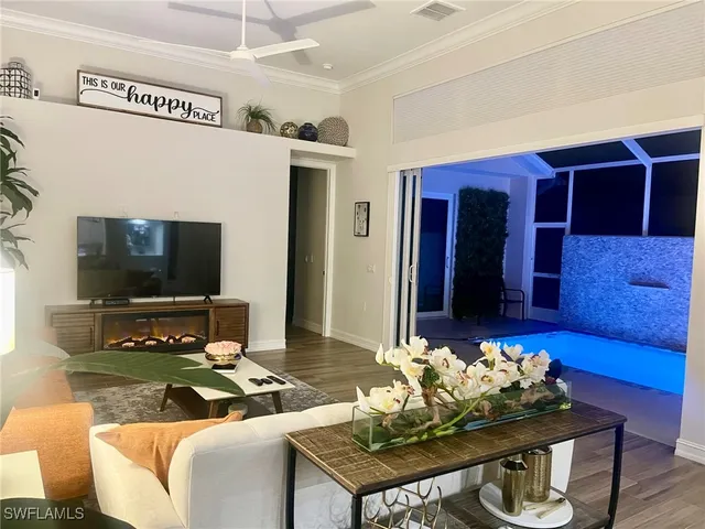 a living room with furniture and a rug