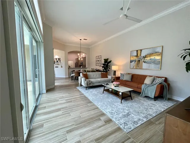 a view of a dining room with furniture and window