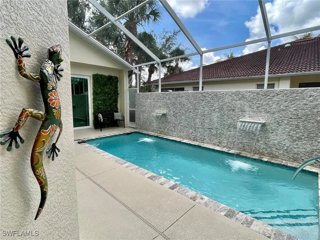 a view of a backyard with a patio and a garden