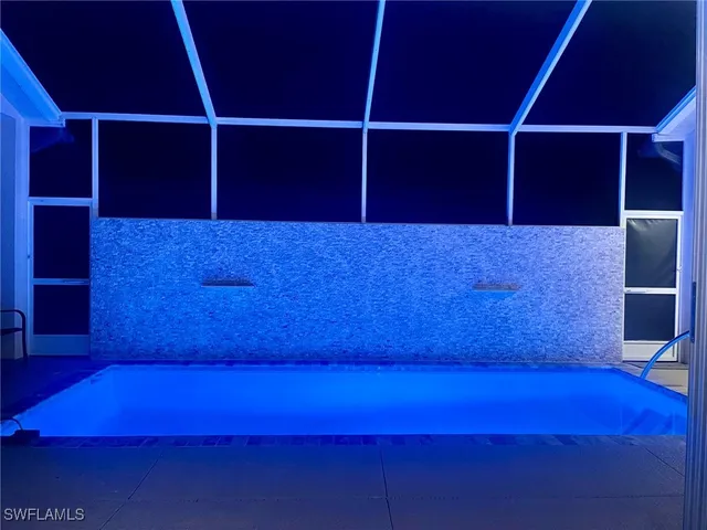 a kitchen with sink and refrigerator