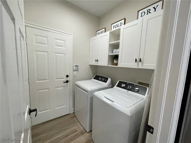 a view of a lake with houses in the background