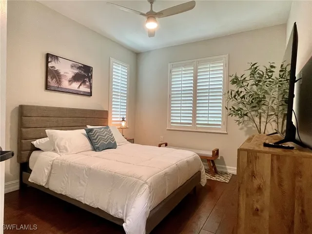 a view of a lake with houses in the back