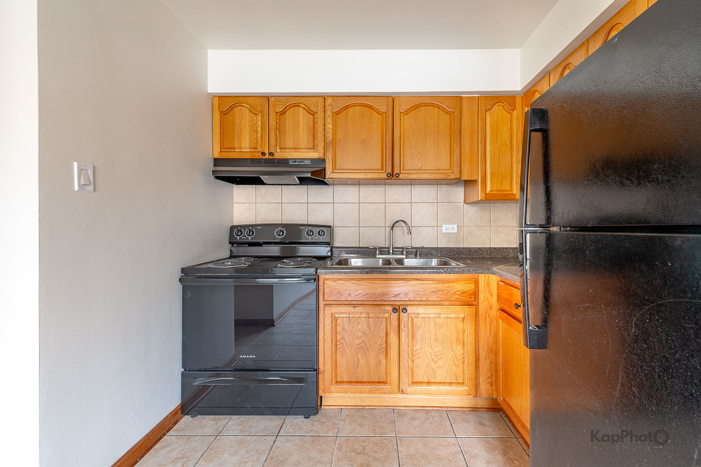 6914 West 65th Street, Unit 7 Chicago, IL 60638 - Photo 14 of 28 a kitchen with stainless steel appliances granite countertop a stove and a refrigerator with granite countertops