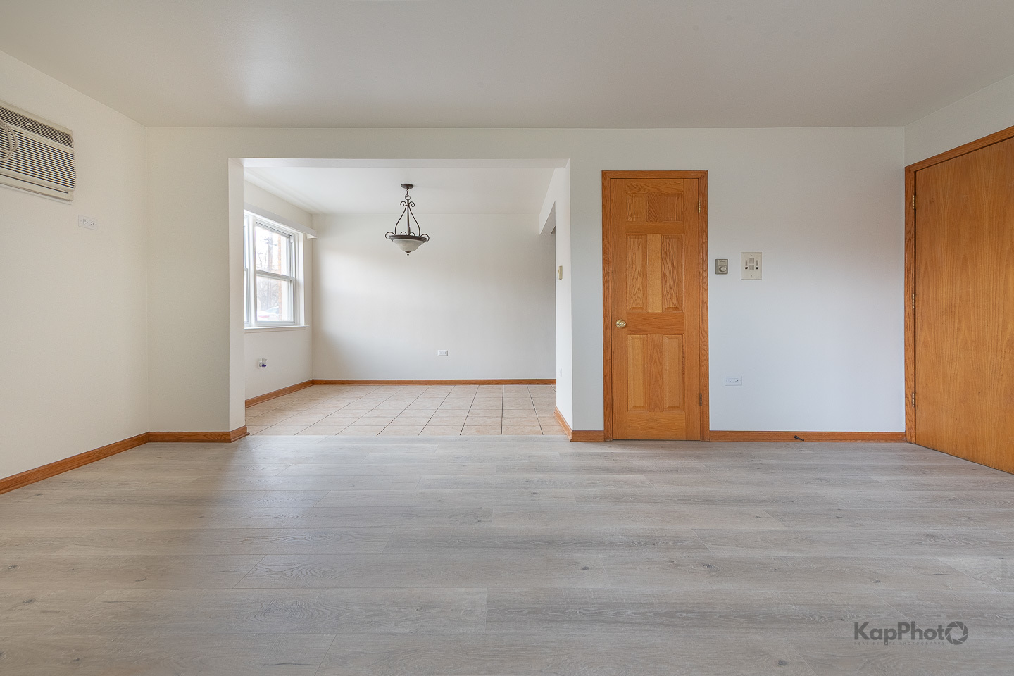 6914 West 65th Street, Unit 7 Chicago, IL 60638 - Photo 8 of 28 a view of an empty room with window and wooden floor