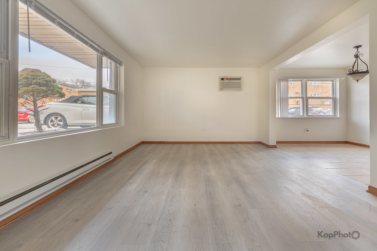 6914 West 65th Street, Unit 7 Chicago, IL 60638 - Photo 10 of 28 an empty room with wooden floor and windows