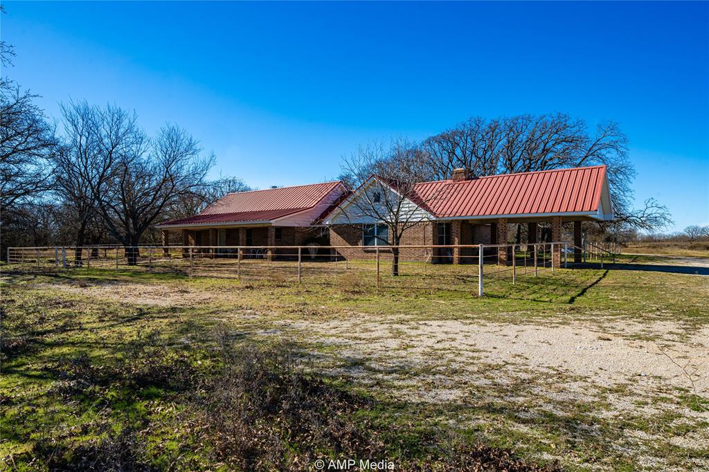 1992 Sand Flat Road Jacksboro, TX 76458 - Photo 22 of 36 Rear view of property featuring a rural view