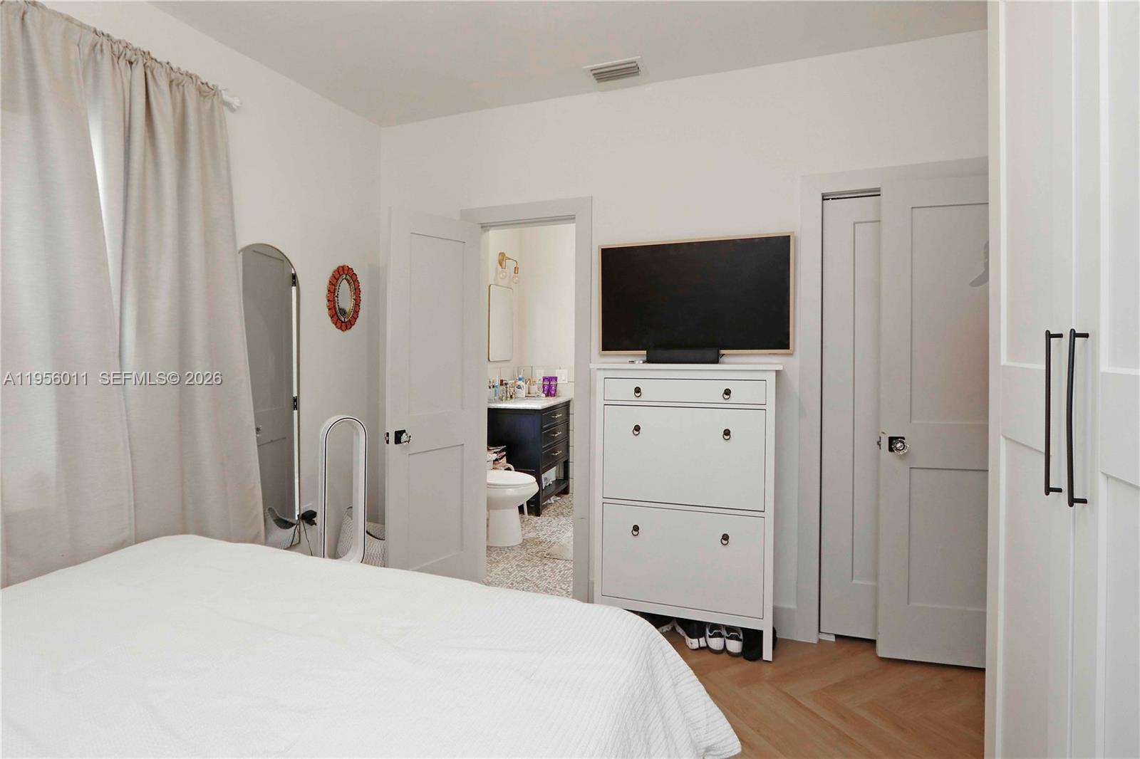 1345 Southwest 17th Street Miami, FL 33145 - Photo 18 of 21 a bedroom with a bed and a flat screen tv