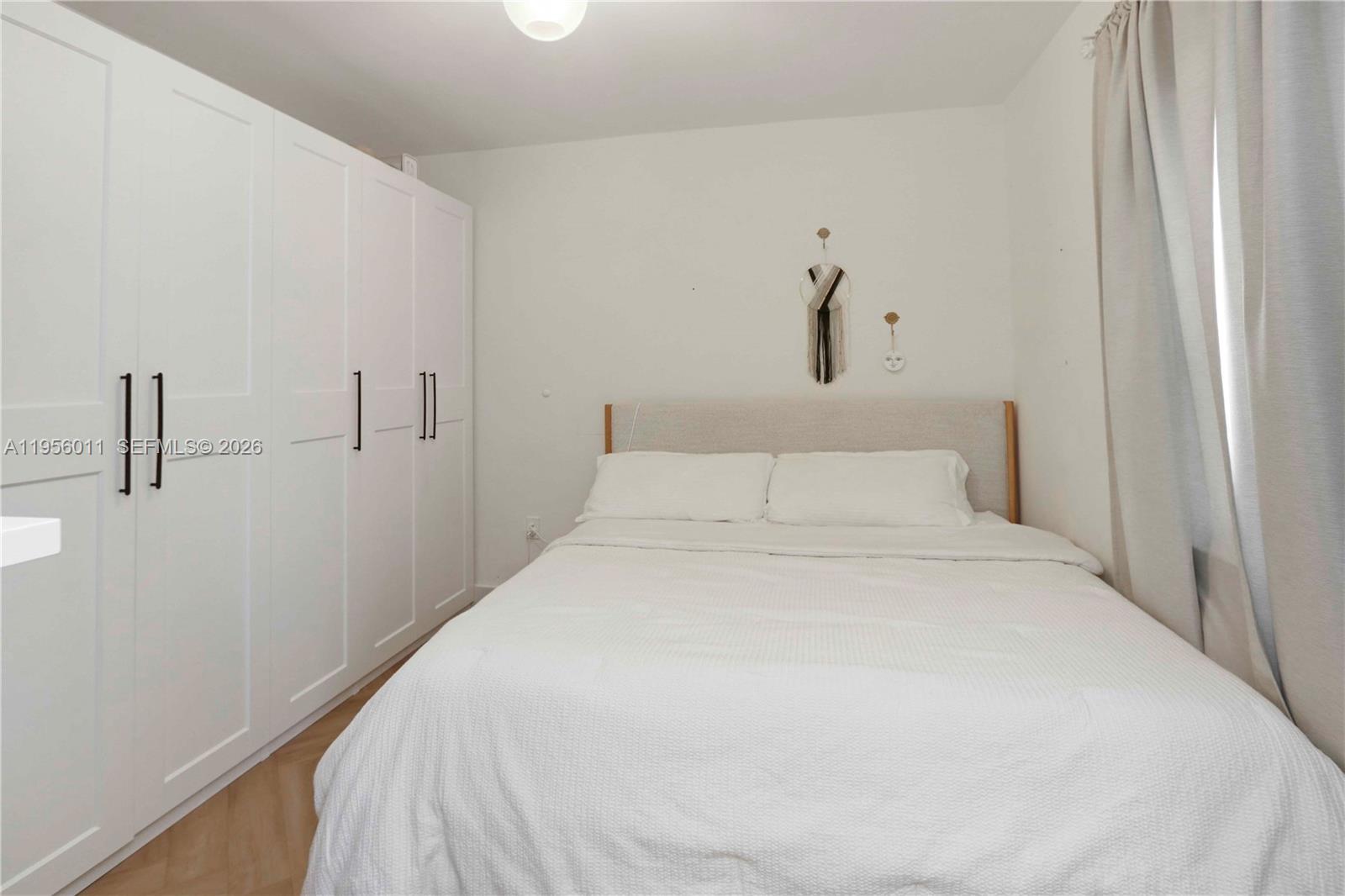 1345 Southwest 17th Street Miami, FL 33145 - Photo 19 of 21 a bedroom with a bed and hallway