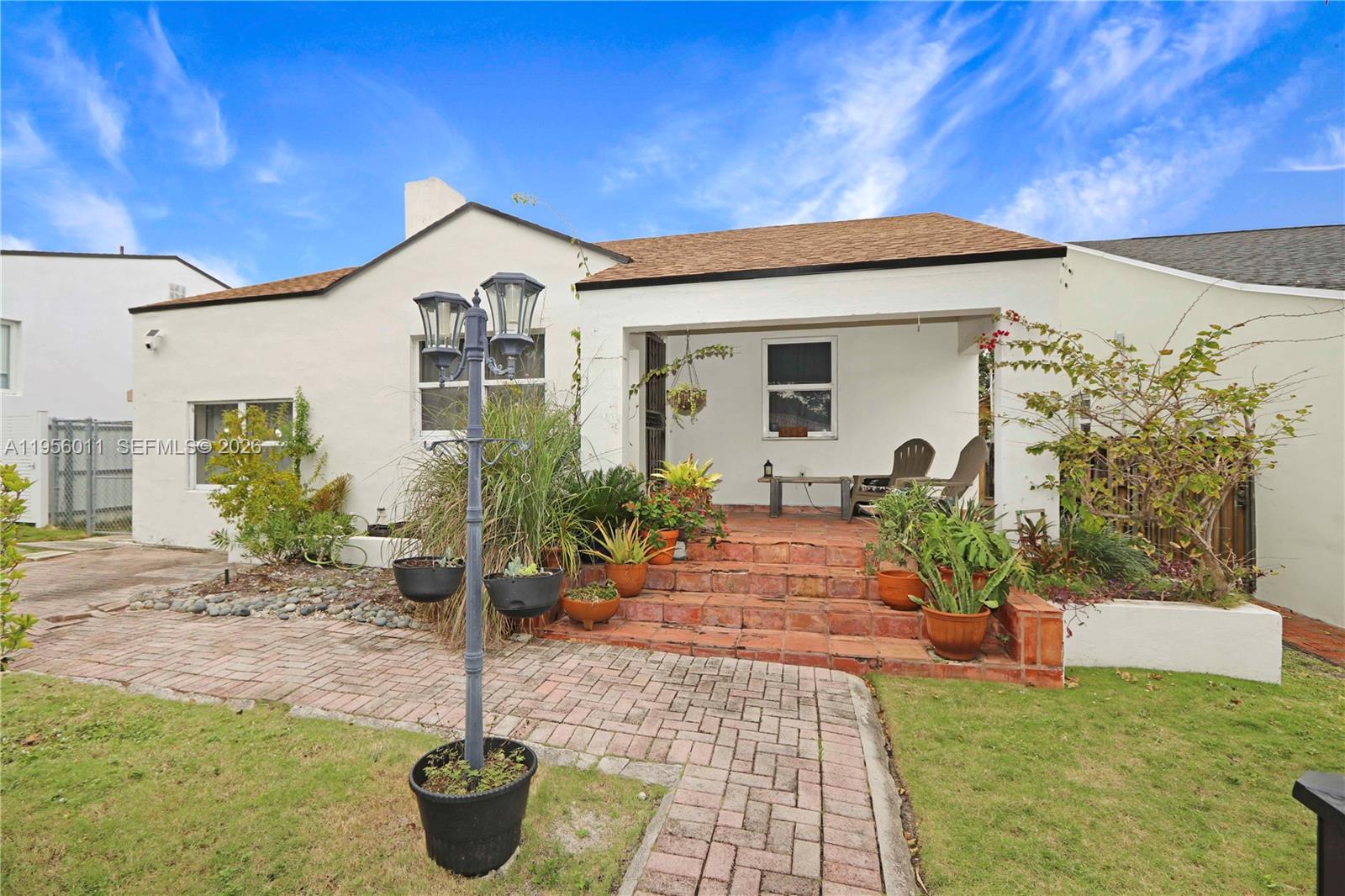 1345 Southwest 17th Street Miami, FL 33145 - Photo 2 of 21 a front view of a house with garden