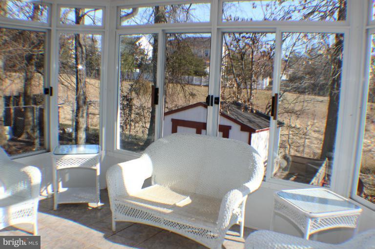 8023 Rocky Run Road Gainesville, VA 20155 - Photo 13 of 30 Enclosed Sunporch with 12x12 Ceramic Floor