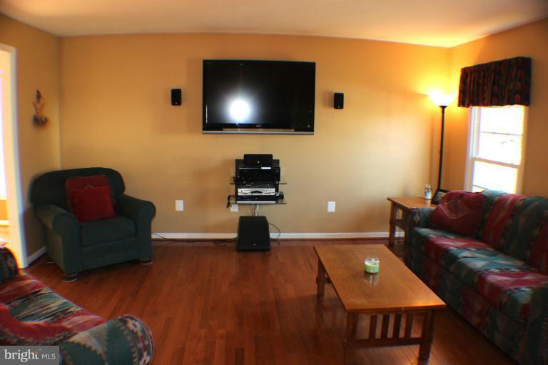 8023 Rocky Run Road Gainesville, VA 20155 - Photo 5 of 30 Living Room with Hardwood floor & 2 windows