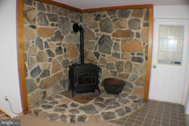 8023 Rocky Run Road Gainesville, VA 20155 - Photo 10 of 30 Custom Stone Hearth and walls