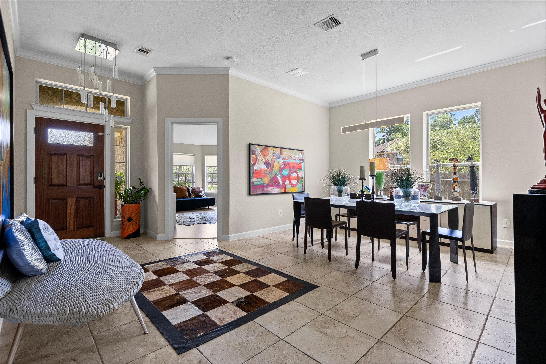 31503 Reston Cliff Court Spring, TX 77386 - Photo 11 of 28 a living room with furniture a dining table and large windows