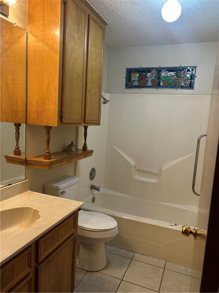 4530 Windows Drive Corpus Christi, TX 78413 - Photo 7 of 11 a bathroom with a sink a toilet and a mirror
