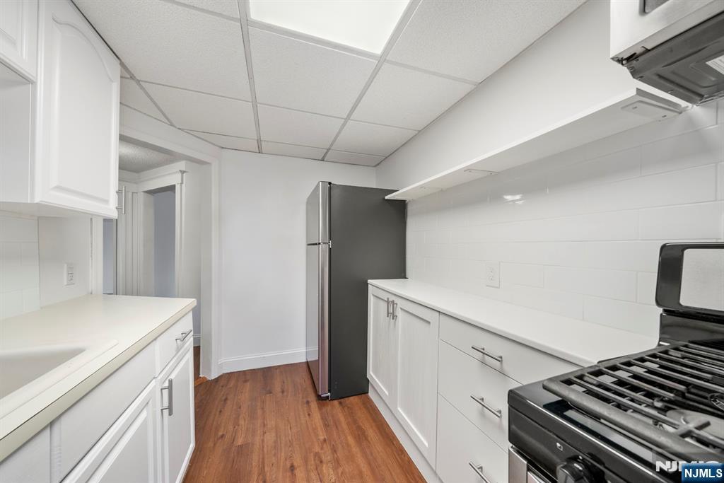 20 Columbus Avenue, Unit 2 Closter, NJ 07624 - Photo 12 of 15 a kitchen with a refrigerator and a stove