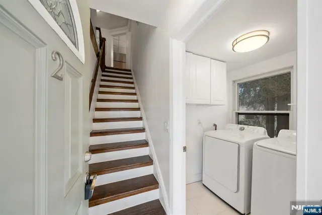 a view of a hallway with washer and dryer