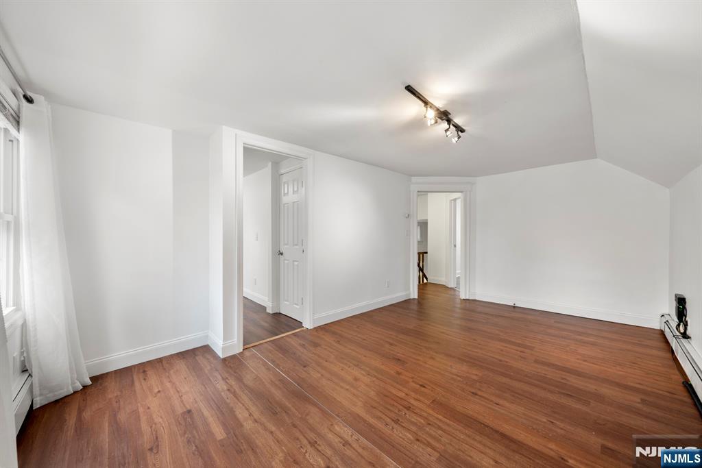 20 Columbus Avenue, Unit 2 Closter, NJ 07624 - Photo 5 of 15 a view of empty room with wooden floor and ceiling fan
