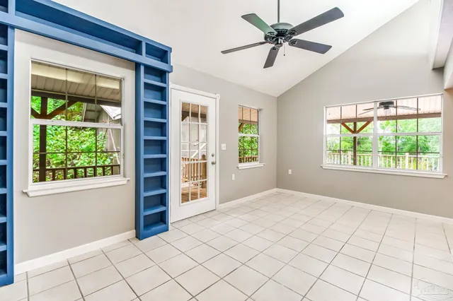 a spacious bathroom with a tub sink and mirror